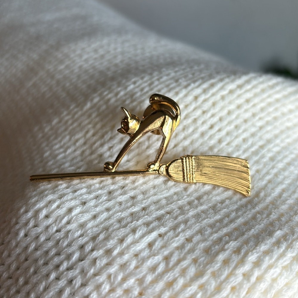 Vintage Avon “Cat on Broomstick” Brooch